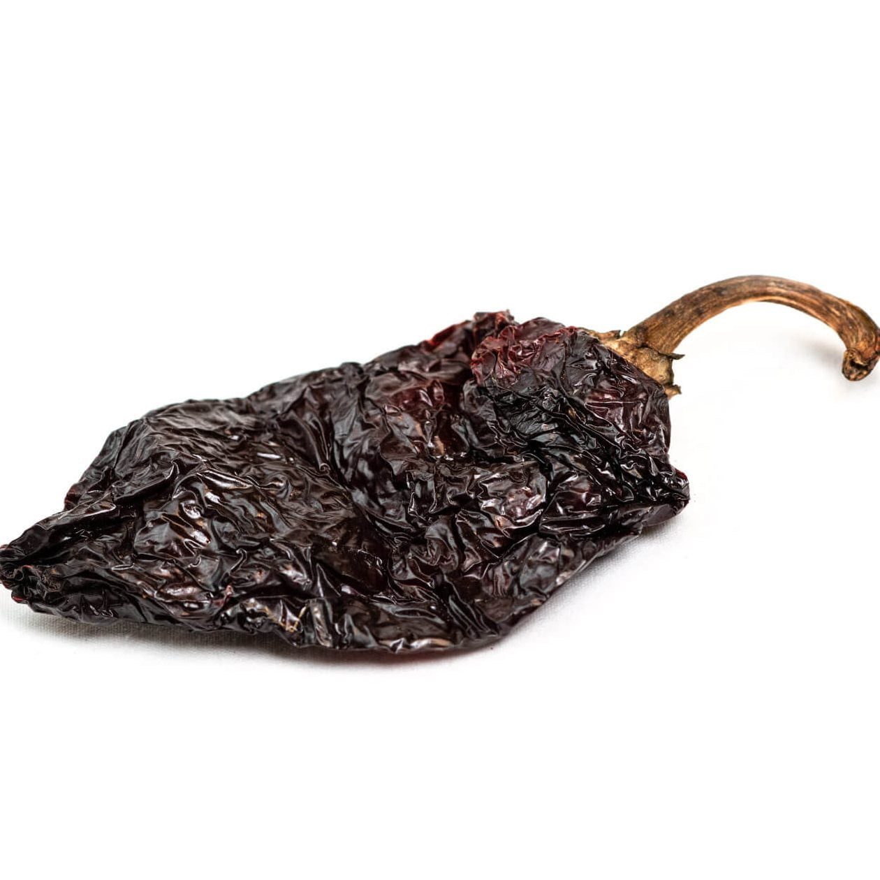 Ancho chile: Dried poblano chili pepper native to Puebla, Mexico.