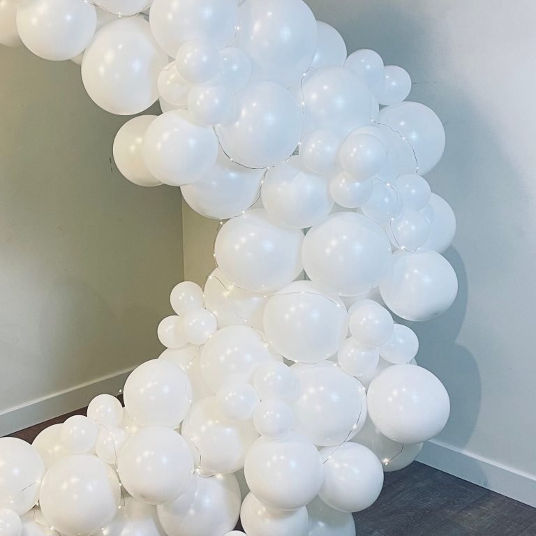 Balloon garland: Decorative display, often in the shape of an arch, made from balloons.