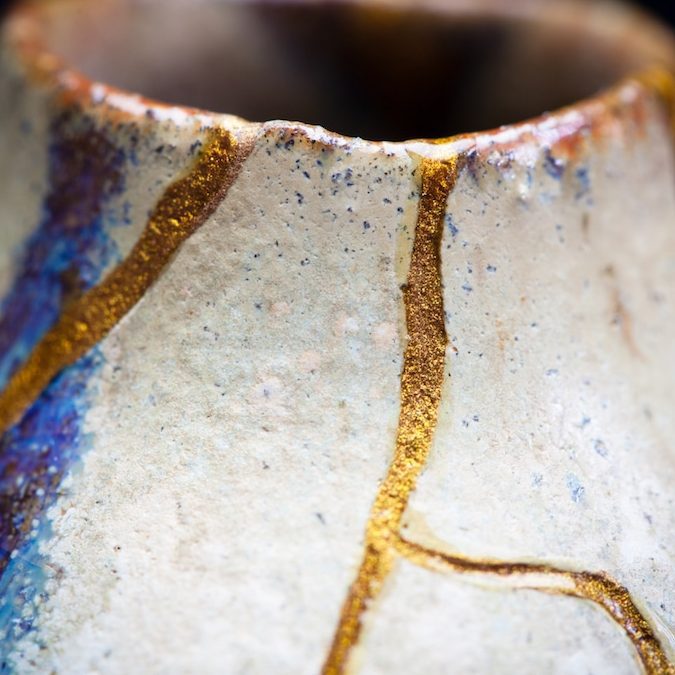 Kintsugi: Golden joinery. Japanese art of restoring broken pottery with gold.