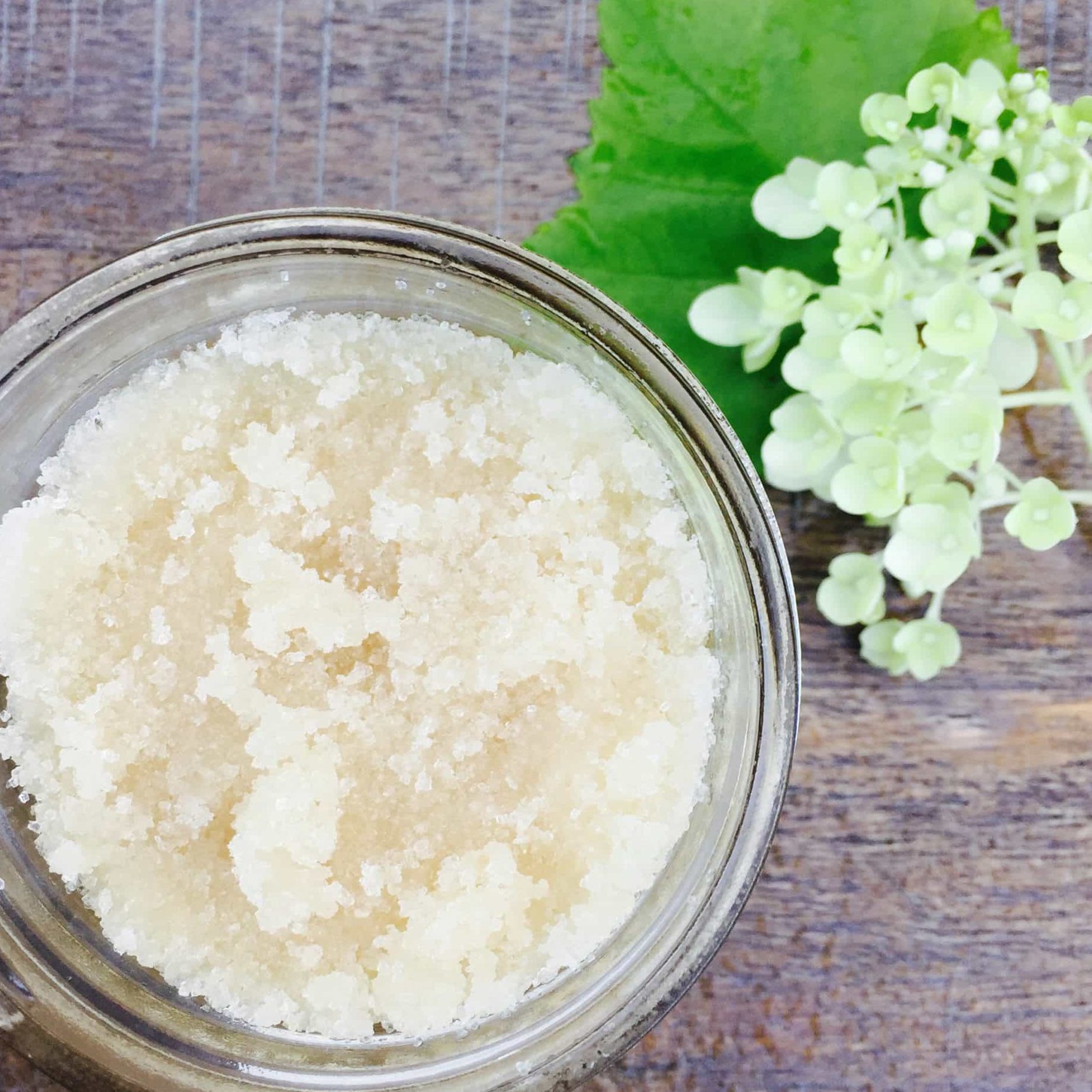 Tree Hut Sugar Scrub: Skincare product designed to exfoliate the skin.