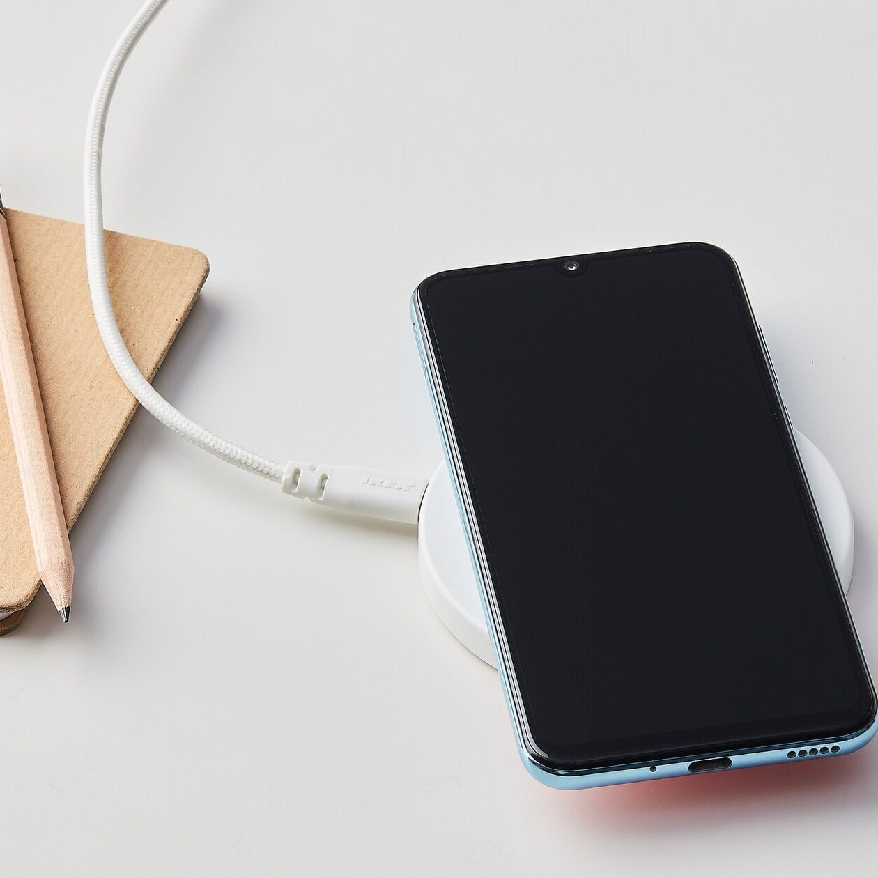 Inductive charging: Wireless charging; uses electromagnetic induction to recharge the batteries of mobile devices.